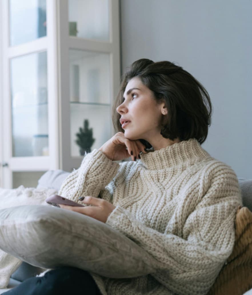 A stay-at-home mom alone on the couch with her thoughts