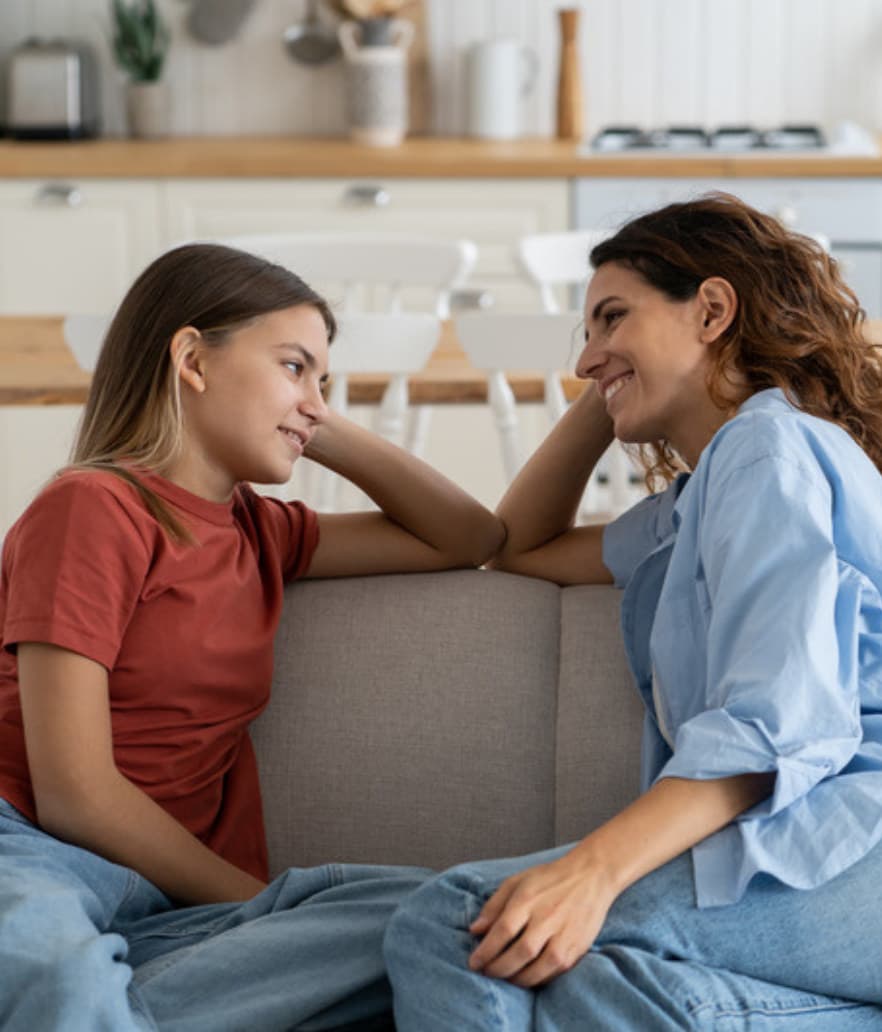 A mom and her teenage daughter in conversation