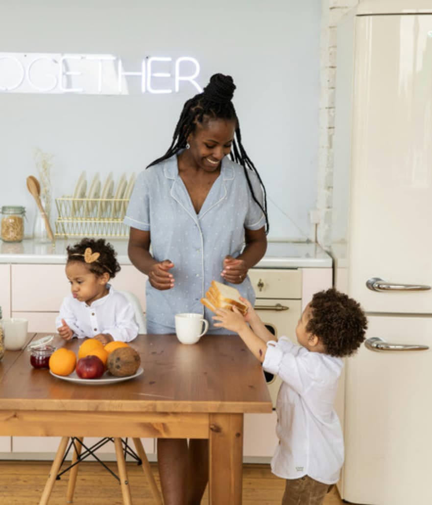A mom getting breakfast together for her two kids