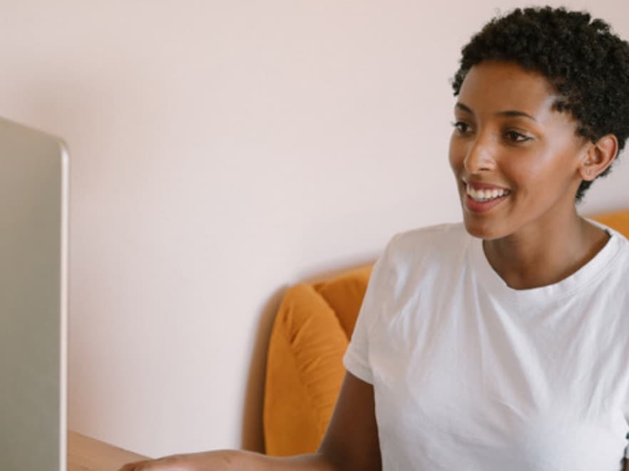 A mom talking with her therapist over video from home