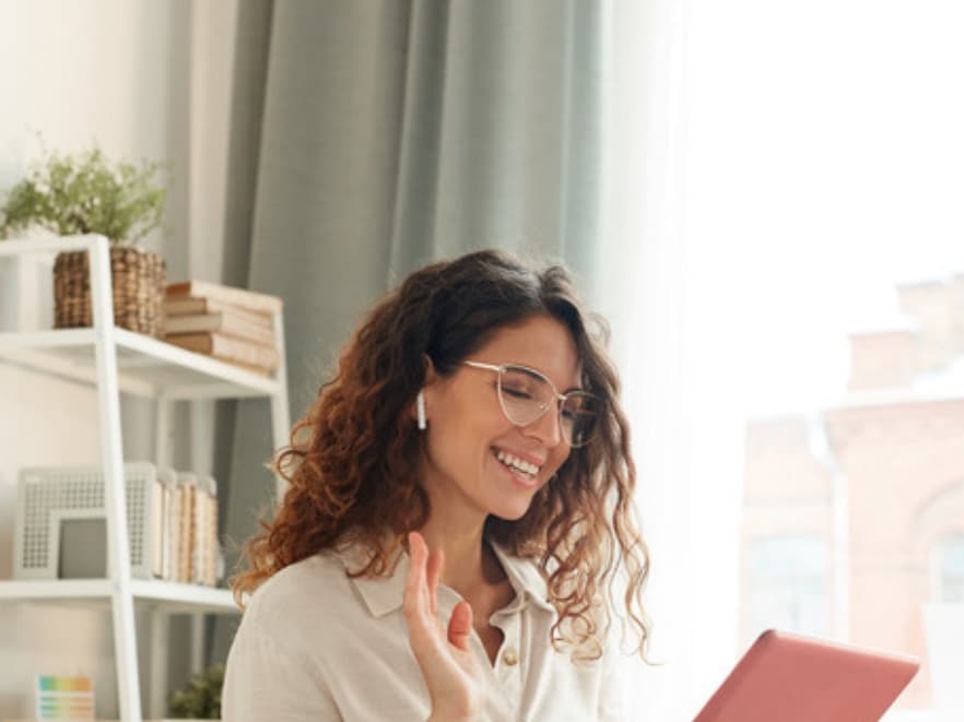 A mom greeting her therapist on a tablet