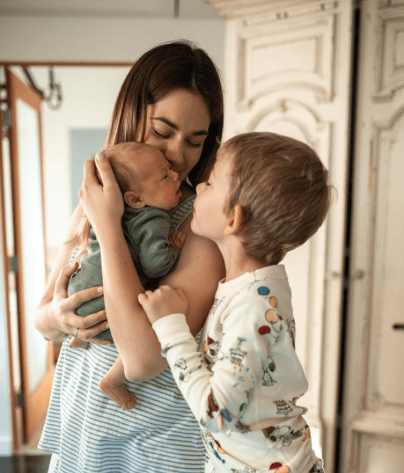 A pregnant mom sitting with anxious, racing thoughts