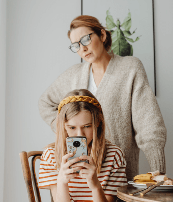 A mom and her child together at the table in a calm, grounded moment