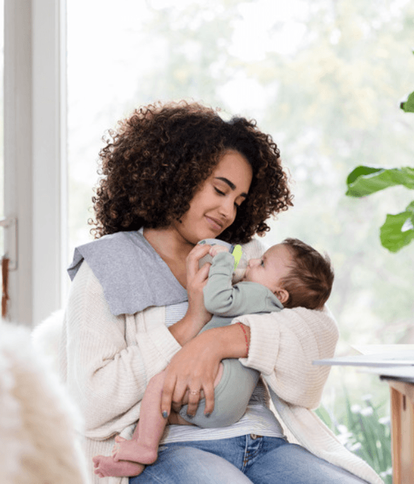 A mom resting quietly with a soft, present expression