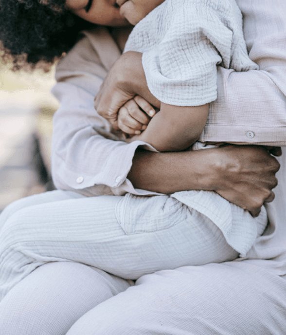 A mom reconnecting with her child outdoors