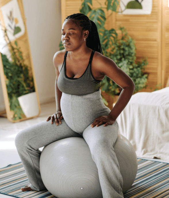 A mom resting with a calm, self-compassionate expression