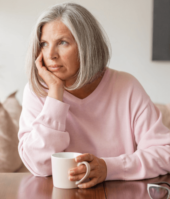A woman in midlife looking calm and supported