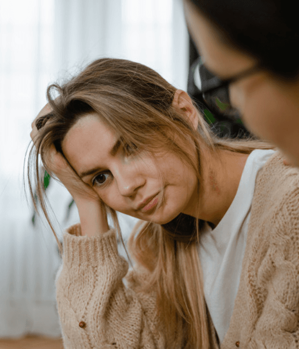 A mom looking tired and overwhelmed at home