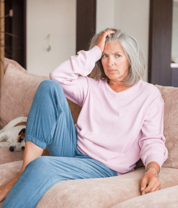 A woman sitting quietly with a heavy feeling