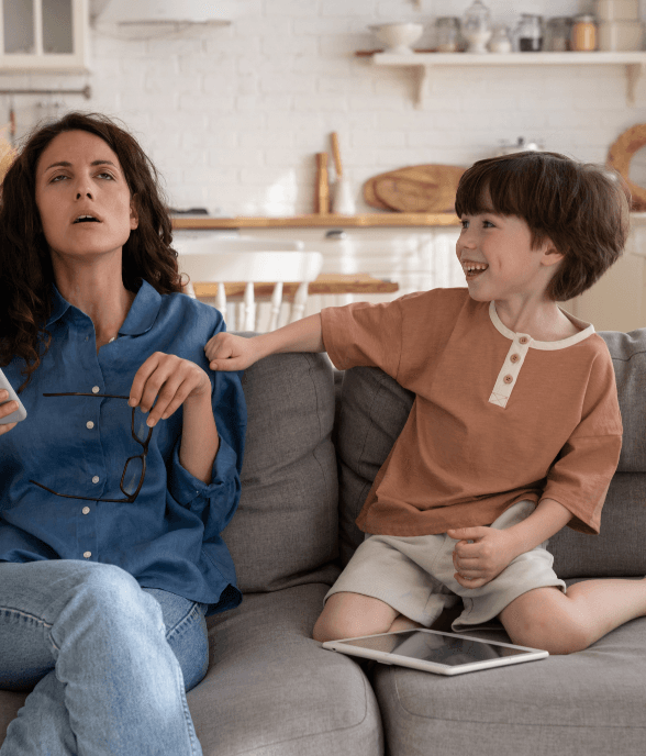 A mom sitting with her child, feeling overwhelmed