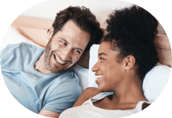 Parents laughing together with their child