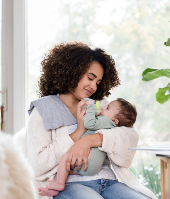 A mom resting quietly with a soft, present expression