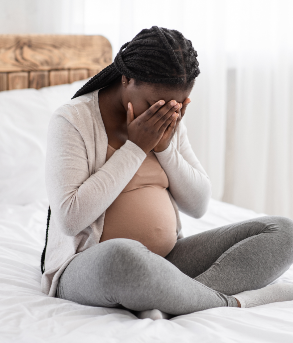 A depleted mom holding her baby, running on empty